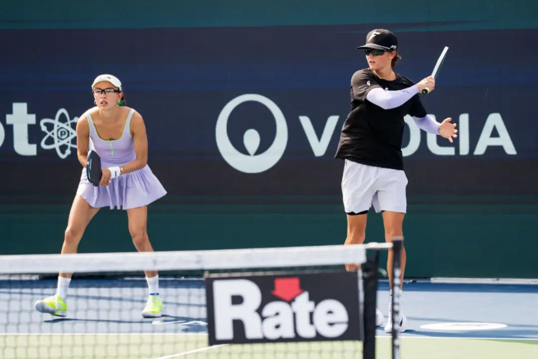 Pickleball players in ready stance practicing fast hands at the net